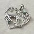 Sterling Silver Caring Hands Heart Pendant with Emerald CZ